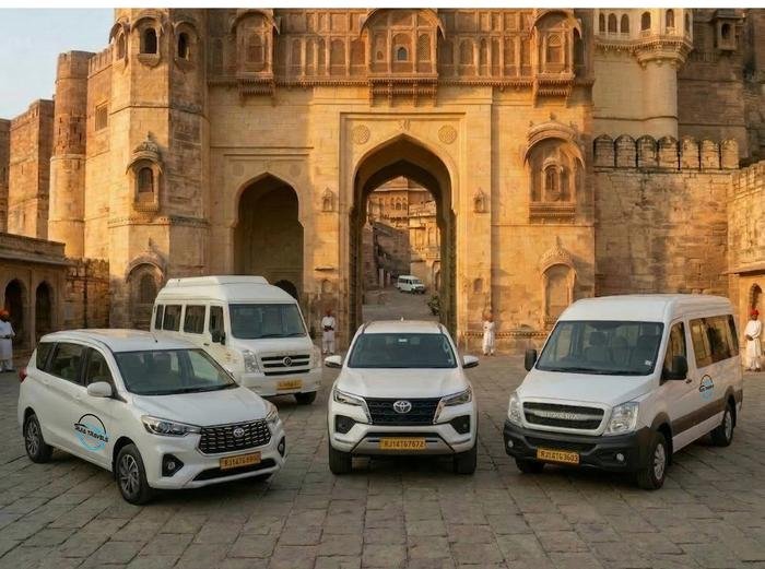 Ruia Travels fleet of vehicles parked outside Mehrangarh Fort in Jodhpur