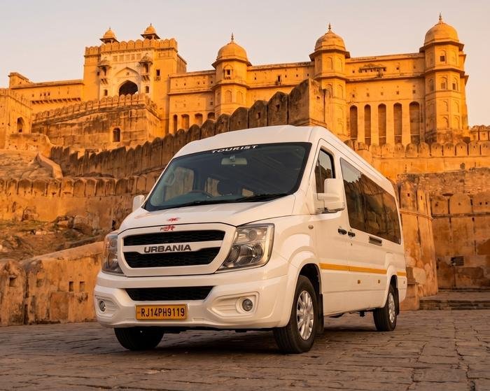 White Force Urbania van parked in front of Amer Fort in Jaipur at sunset